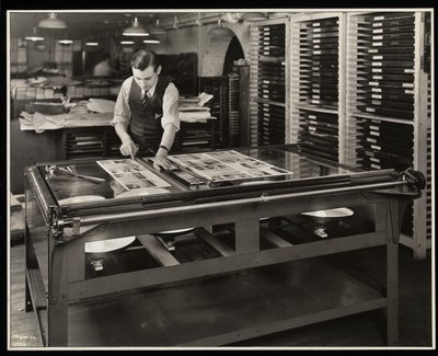 Working on a layout at a light table at Unz und Co., 24 Beaver Street, New York by Byron Company